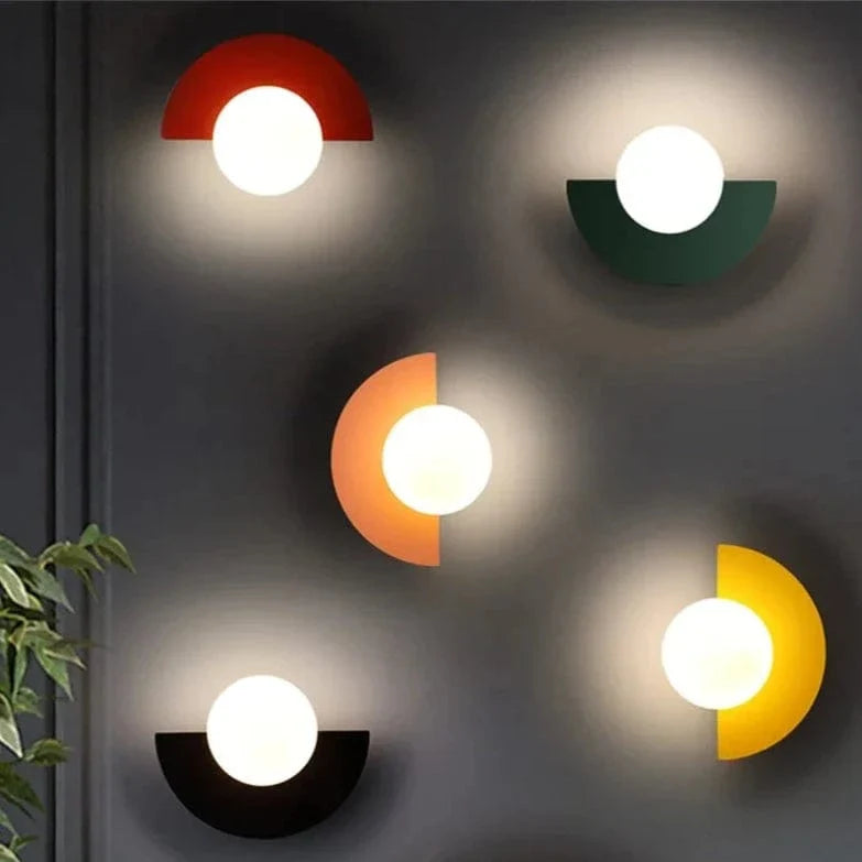 Verthara Frosted Globe Wrought Iron Wall Light