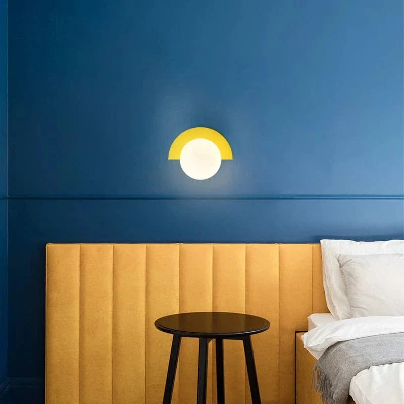 Verthara Frosted Globe Wrought Iron Wall Light
