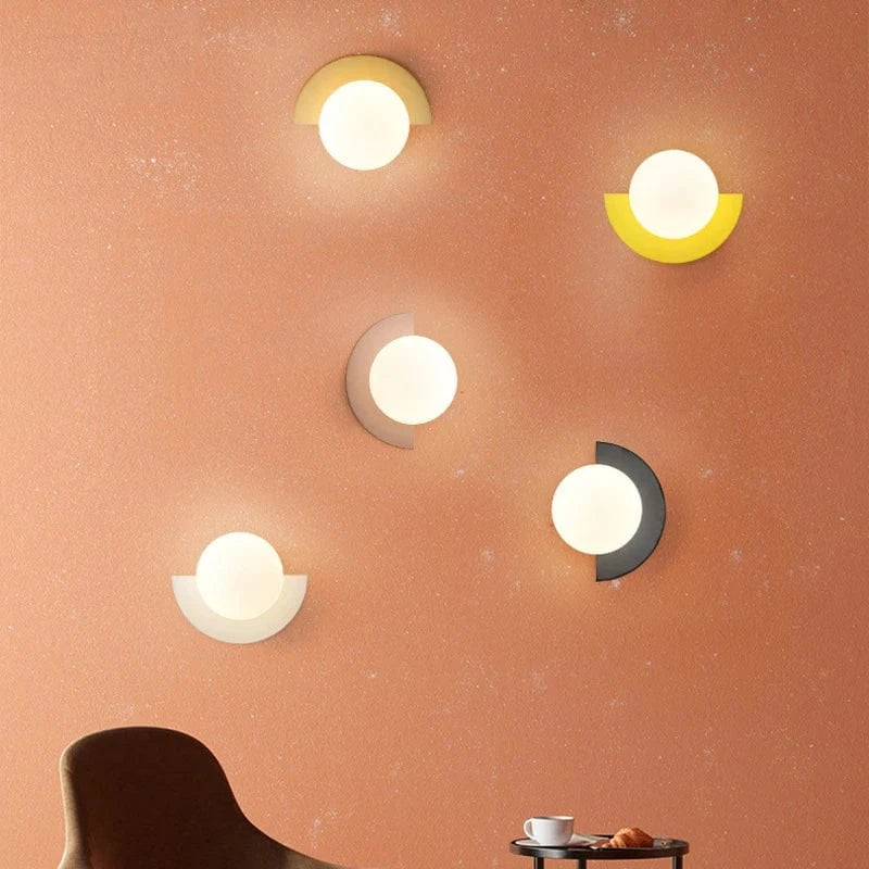 Verthara Frosted Globe Wrought Iron Wall Light