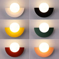 Verthara Frosted Globe Wrought Iron Wall Light